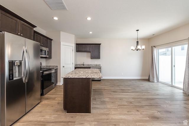 200 W 1200 S Unit 52, Tremonton, UT 84337 - kitchen with stainless steel appliances, a chandelier, dark brown cabinets, a kitchen island, and recessed lighting