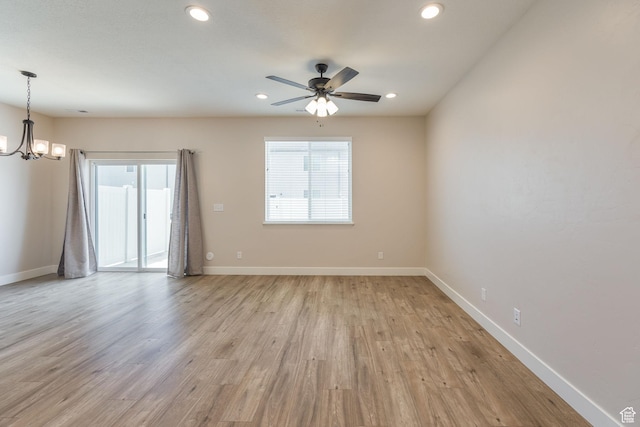 200 W 1200 S Unit 52, Tremonton, UT 84337 - empty room featuring a chandelier, baseboards, light wood-type flooring, a ceiling fan, and recessed lighting