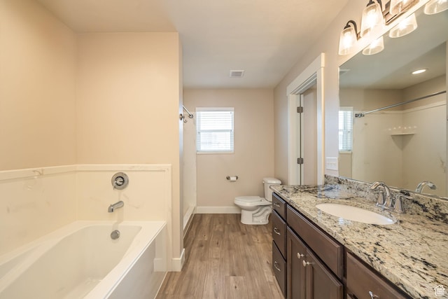 200 W 1200 S Unit 52, Tremonton, UT 84337 - full bathroom featuring a bath, vanity, toilet, wood finished floors, and baseboards