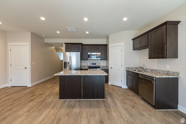 200 W 1200 S Unit 52, Tremonton, UT 84337 - kitchen with stainless steel appliances, dark brown cabinets, a sink, a center island, and recessed lighting