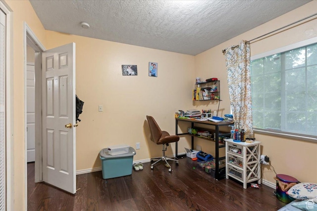 7638 S Redwood Rd Unit 17, West Jordan, UT 84084 - office area with wood finished floors, baseboards, a textured ceiling, and healthy amount of natural light