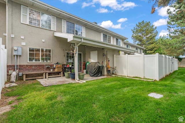 7638 S Redwood Rd Unit 17, West Jordan, UT 84084 - rear view of house with stucco siding and a patio area