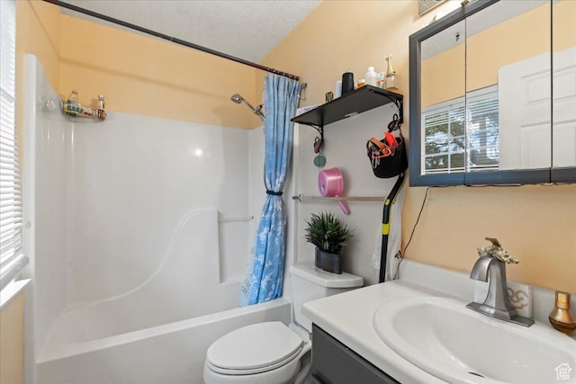 7638 S Redwood Rd Unit 17, West Jordan, UT 84084 - bathroom featuring shower / bath combo with shower curtain, toilet, and vanity
