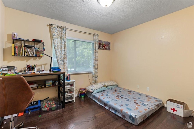 7638 S Redwood Rd Unit 17, West Jordan, UT 84084 - bedroom with wood finished floors and a textured ceiling