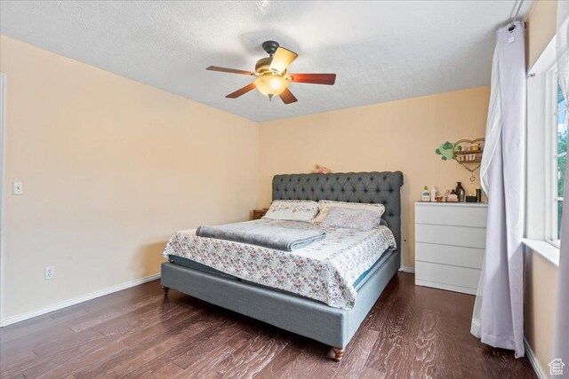 7638 S Redwood Rd Unit 17, West Jordan, UT 84084 - bedroom featuring wood finished floors, baseboards, a textured ceiling, and ceiling fan
