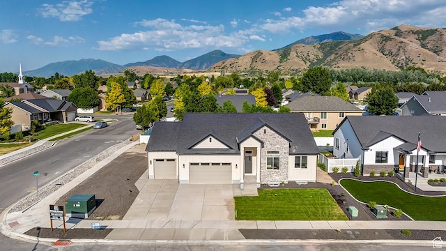 1605 S 1100 W, Payson, UT 84651 - view of front of home with a residential view, concrete driveway, an attached garage, and a mountain view