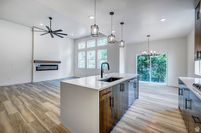 1605 S 1100 W, Payson, UT 84651 - kitchen with light wood finished floors, a chandelier, light countertops, a kitchen island with sink, and recessed lighting