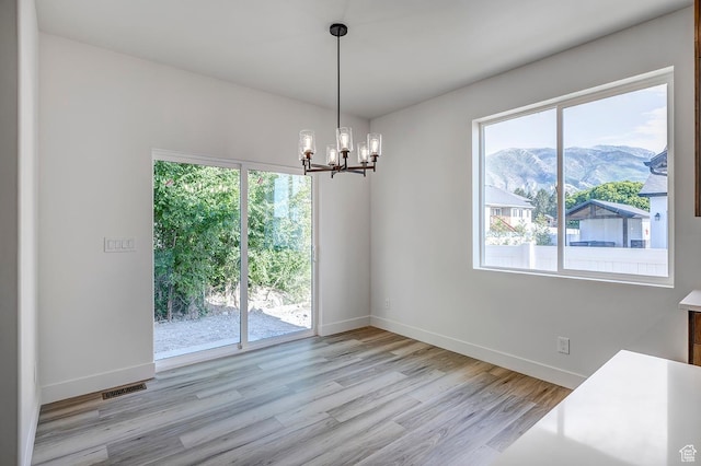 1605 S 1100 W, Payson, UT 84651 - spare room with a mountain view, light wood-type flooring, and a chandelier