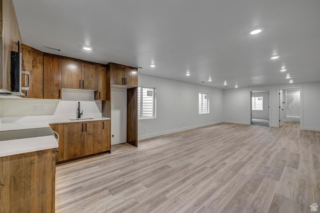 1605 S 1100 W, Payson, UT 84651 - kitchen with stainless steel microwave, light countertops, recessed lighting, light wood finished floors, and plenty of natural light