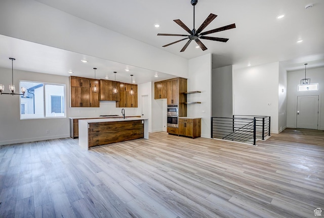 1605 S 1100 W, Payson, UT 84651 - kitchen with open shelves, open floor plan, brown cabinetry, light countertops, and recessed lighting