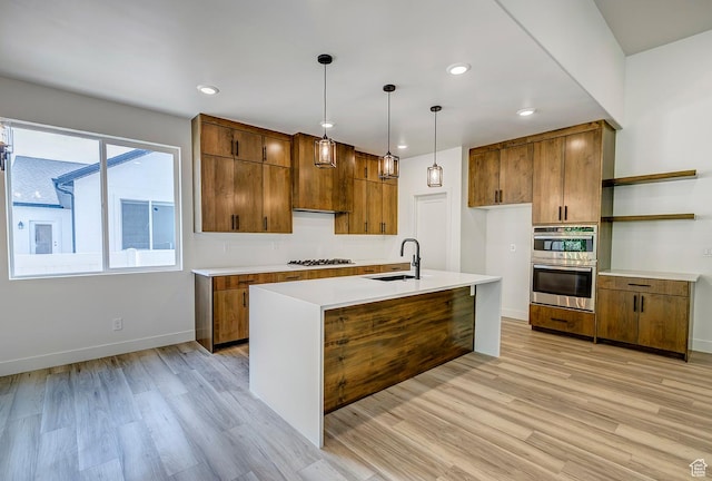 1605 S 1100 W, Payson, UT 84651 - kitchen with open shelves, light wood-style floors, gas cooktop, brown cabinets, and recessed lighting