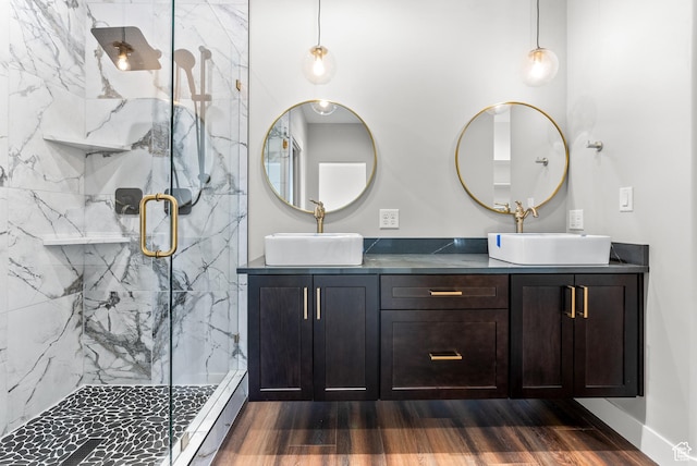 275 S 2800 E Unit 201, Spanish Fork, UT 84660 - bathroom featuring double vanity, a marble finish shower, wood finished floors, and baseboards