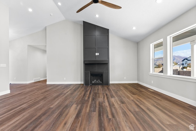275 S 2800 E Unit 201, Spanish Fork, UT 84660 - unfurnished living room featuring vaulted ceiling, a ceiling fan, dark wood-style flooring, recessed lighting, and a large fireplace