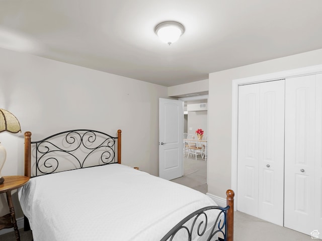 7764 S Rustic Pine Cv, Midvale, UT 84047 - bedroom featuring light carpet, a closet, and baseboards