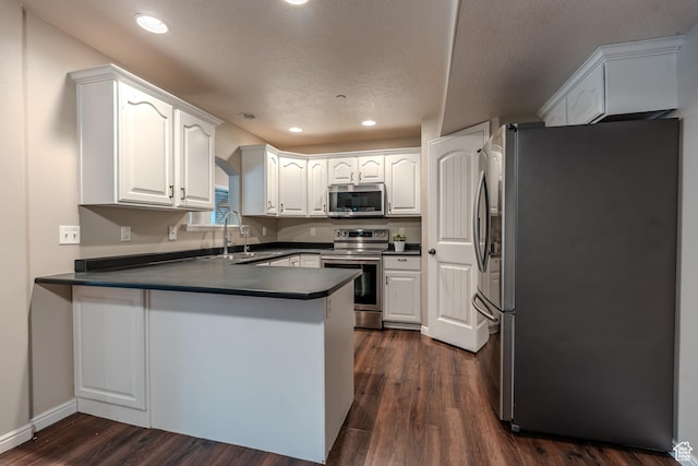 943 W 580 S Unit 97, Pleasant Grove, UT 84062 - kitchen featuring appliances with stainless steel finishes, a sink, a peninsula, dark countertops, and recessed lighting