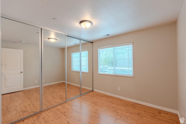 943 W 580 S Unit 97, Pleasant Grove, UT 84062 - unfurnished bedroom with wood finished floors, baseboards, and a closet