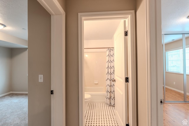 943 W 580 S Unit 97, Pleasant Grove, UT 84062 - corridor featuring baseboards and a textured ceiling