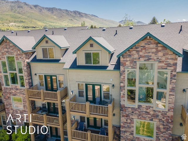 3521 N Moose Hollow Dr Unit 1202, Eden, UT 84310 - view of front of home featuring stone siding, a mountain view, and a balcony