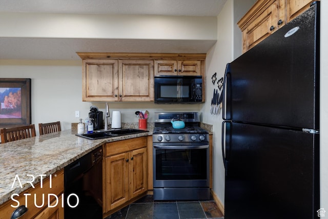 3521 N Moose Hollow Dr Unit 1202, Eden, UT 84310 - kitchen featuring black appliances, a sink, light stone counters, brown cabinets, and a peninsula