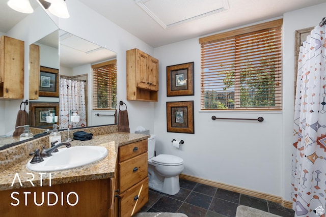 3521 N Moose Hollow Dr Unit 1202, Eden, UT 84310 - bathroom with toilet, vanity, baseboards, and healthy amount of natural light