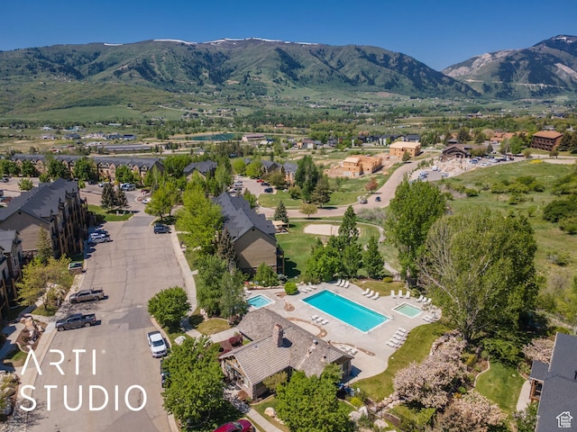 3521 N Moose Hollow Dr Unit 1202, Eden, UT 84310 - aerial view of property and surrounding area featuring mountains and a pool area