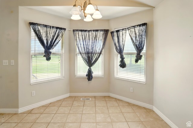 2865 W 3600 N, Farr West, UT 84404 - unfurnished room with a chandelier, baseboards, and light tile patterned flooring