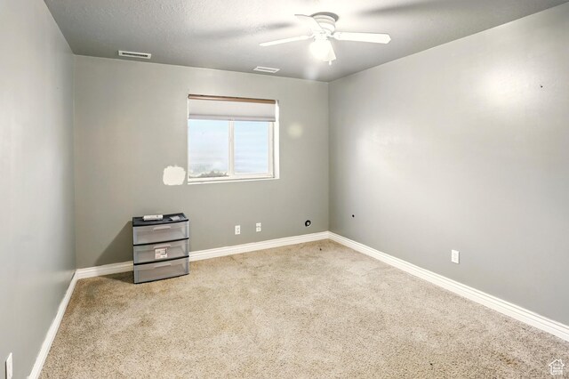 2865 W 3600 N, Farr West, UT 84404 - carpeted spare room featuring a ceiling fan and baseboards