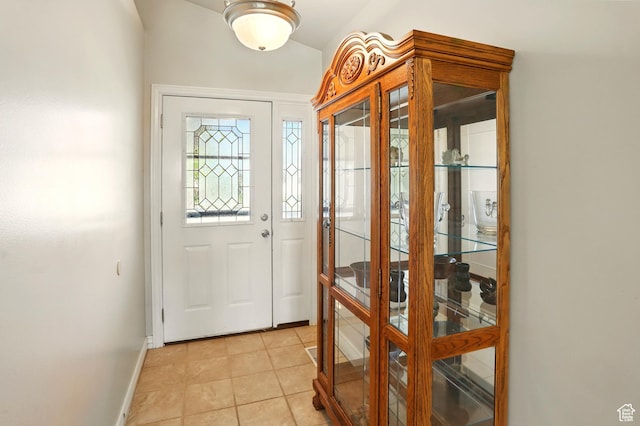 2865 W 3600 N, Farr West, UT 84404 - doorway featuring light tile patterned flooring, baseboards, and vaulted ceiling