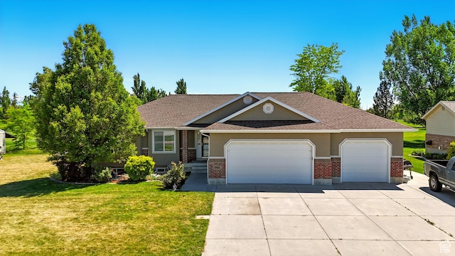2865 W 3600 N, Farr West, UT 84404 - view of front of home featuring a garage, driveway, brick siding, a front lawn, and stucco siding