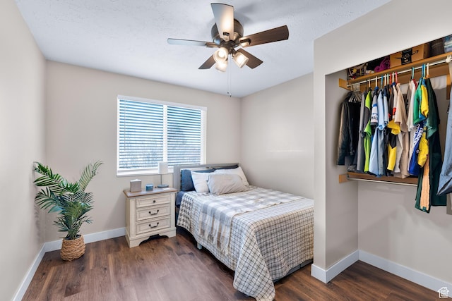 1962 W 12110 S, Riverton, UT 84065 - bedroom with baseboards, dark wood-style floors, a ceiling fan, and a closet
