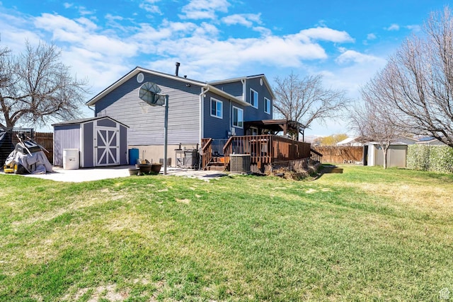 1962 W 12110 S, Riverton, UT 84065 - rear view of property featuring a wooden deck, central AC, and a patio area