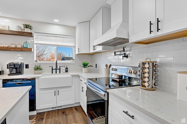 1962 W 12110 S, Riverton, UT 84065 - kitchen featuring stainless steel range with electric cooktop, custom exhaust hood, a sink, dishwashing machine, and white cabinetry