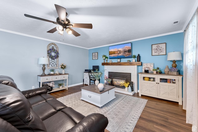 1962 W 12110 S, Riverton, UT 84065 - living area featuring ceiling fan, dark wood-style floors, a fireplace, crown molding, and baseboards