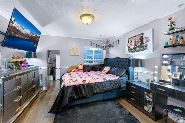 1962 W 12110 S, Riverton, UT 84065 - bedroom featuring ornamental molding, a textured ceiling, and wood finished floors