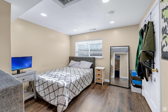 1962 W 12110 S, Riverton, UT 84065 - bedroom featuring wood finished floors, a textured ceiling, recessed lighting, and baseboards