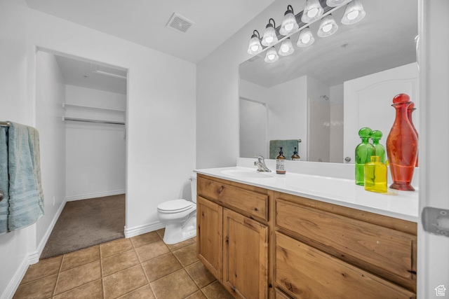 685 S 2220 W Unit 302, Pleasant Grove, UT 84062 - bathroom with vanity, toilet, tile patterned flooring, and baseboards