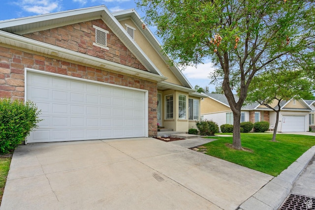 12482 S Tithing Point Dr, Riverton, UT 84065 - view of front facade featuring driveway, stone siding, and a front lawn
