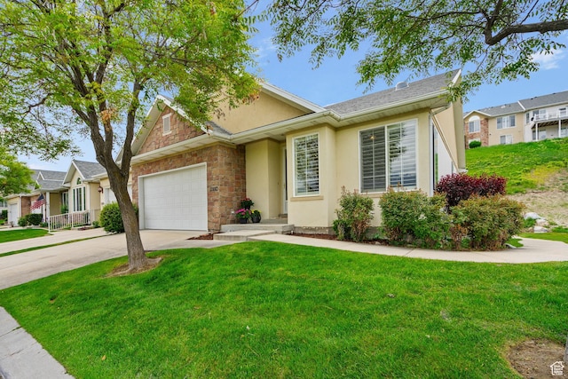 12482 S Tithing Point Dr, Riverton, UT 84065 - view of front of home with stucco siding, driveway, an attached garage, and a front yard