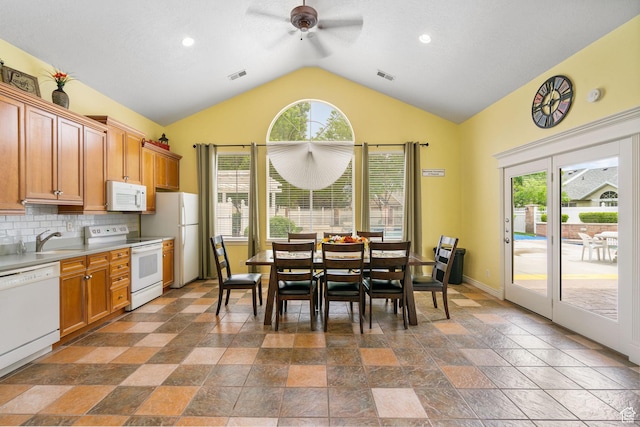 12482 S Tithing Point Dr, Riverton, UT 84065 - kitchen featuring white appliances, a ceiling fan, vaulted ceiling, plenty of natural light, and light countertops