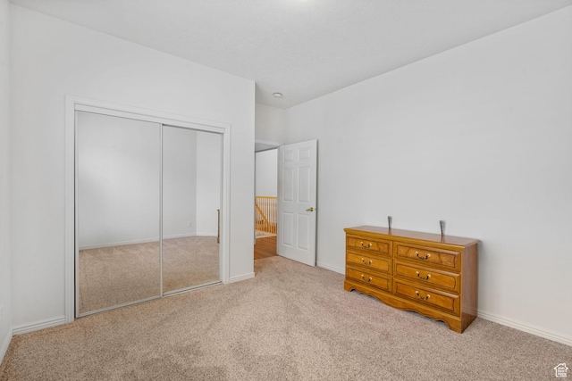 12482 S Tithing Point Dr, Riverton, UT 84065 - carpeted bedroom featuring a closet and baseboards