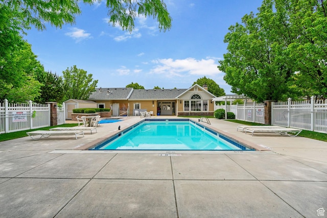 12482 S Tithing Point Dr, Riverton, UT 84065 - community pool featuring a patio area