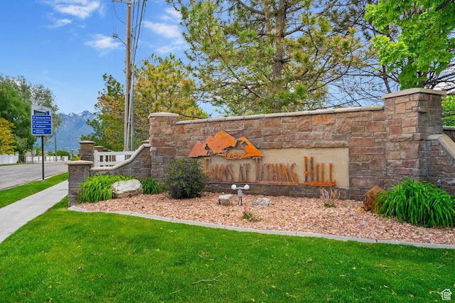 12482 S Tithing Point Dr, Riverton, UT 84065 - community sign with a lawn and a mountain view