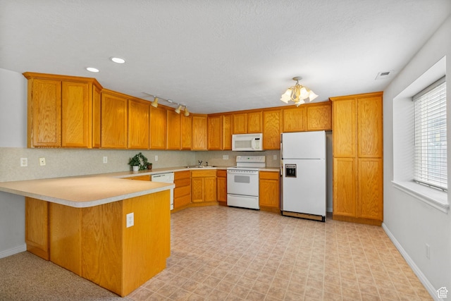 12482 S Tithing Point Dr, Riverton, UT 84065 - kitchen featuring white appliances, a peninsula, light countertops, a sink, and brown cabinets