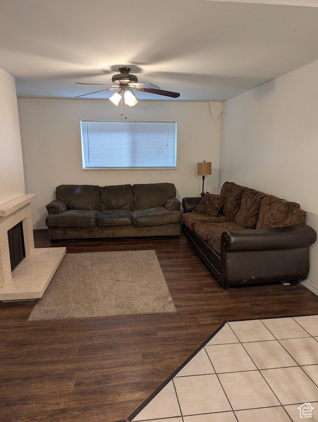240 E 400 N Unit 41, Logan, UT 84321 - living area with ceiling fan, wood finished floors, and a high end fireplace