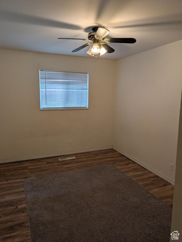 240 E 400 N Unit 41, Logan, UT 84321 - spare room with dark wood-type flooring, ceiling fan, and baseboards