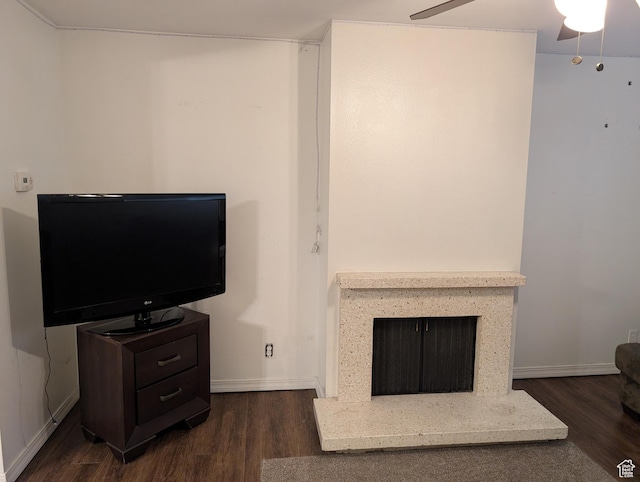 240 E 400 N Unit 41, Logan, UT 84321 - living room with wood finished floors, ceiling fan, a fireplace with raised hearth, and baseboards