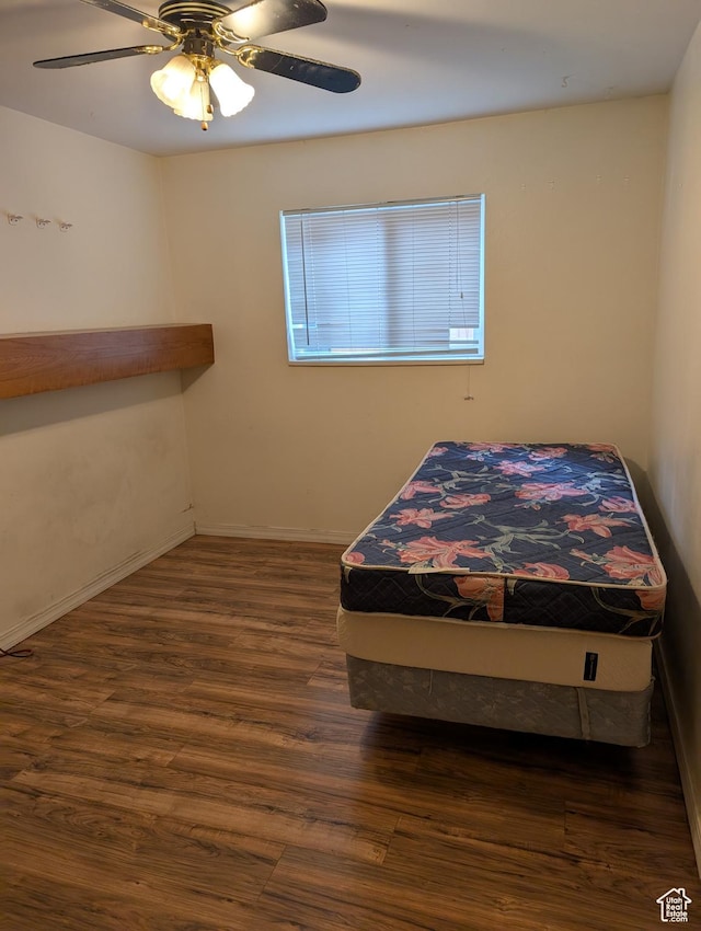 240 E 400 N Unit 41, Logan, UT 84321 - bedroom with wood finished floors, a ceiling fan, and baseboards