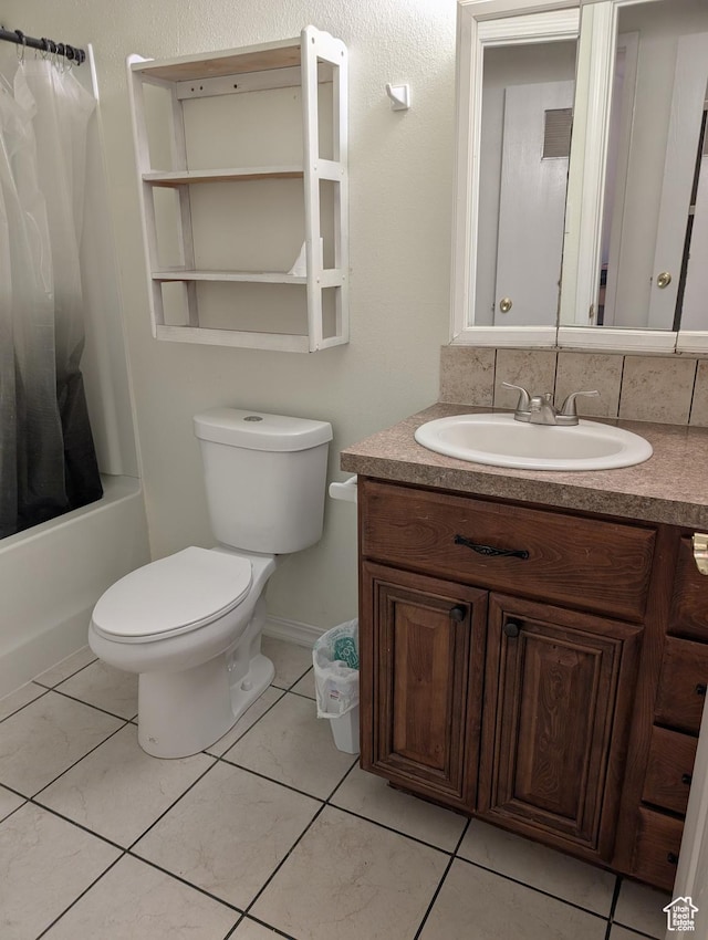 240 E 400 N Unit 41, Logan, UT 84321 - full bathroom with vanity, shower / bath combo with shower curtain, toilet, and tile patterned flooring