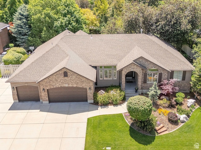 250 E 950 N, Kaysville, UT 84037 - french provincial home with brick siding, an attached garage, concrete driveway, and roof with shingles