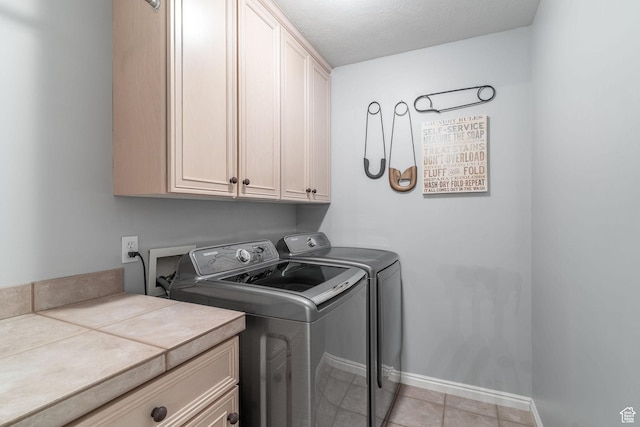 250 E 950 N, Kaysville, UT 84037 - laundry area with cabinet space, washer and dryer, light tile patterned floors, and baseboards